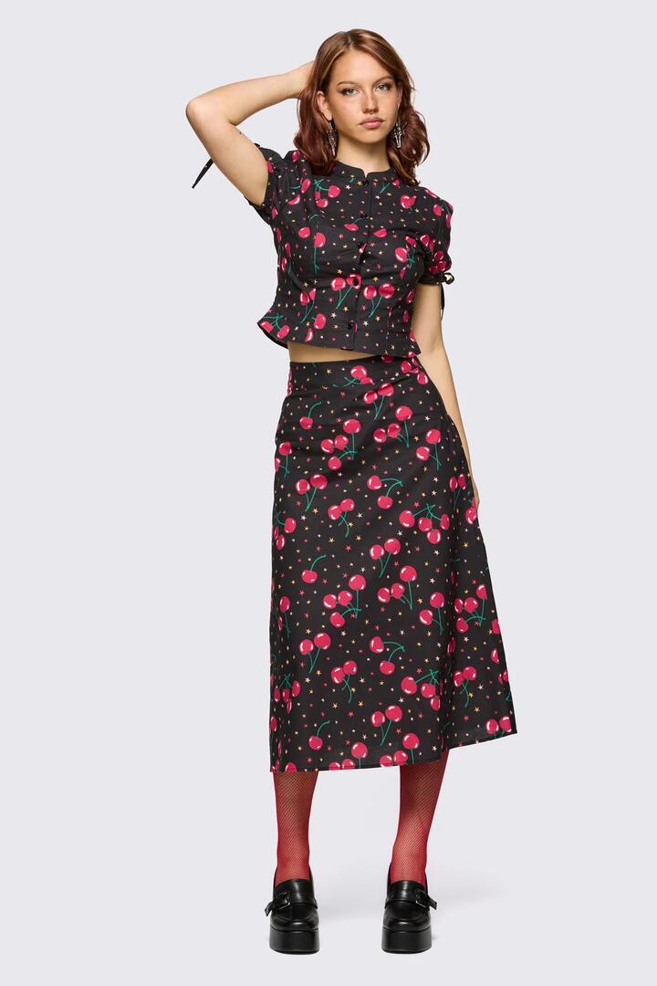 Image of a model wearing Skirts. Product name - Delulu Print Midi Skirt in Black colour by brand - Dangerfield