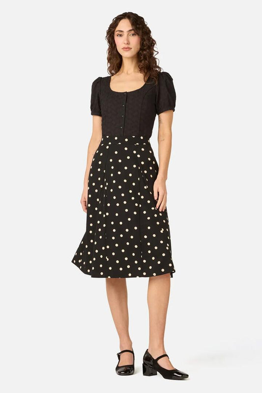 Image of a model wearing Skirts. Product name - Kelly Polka Dot Skirt in Rust colour by brand - Princess Highway