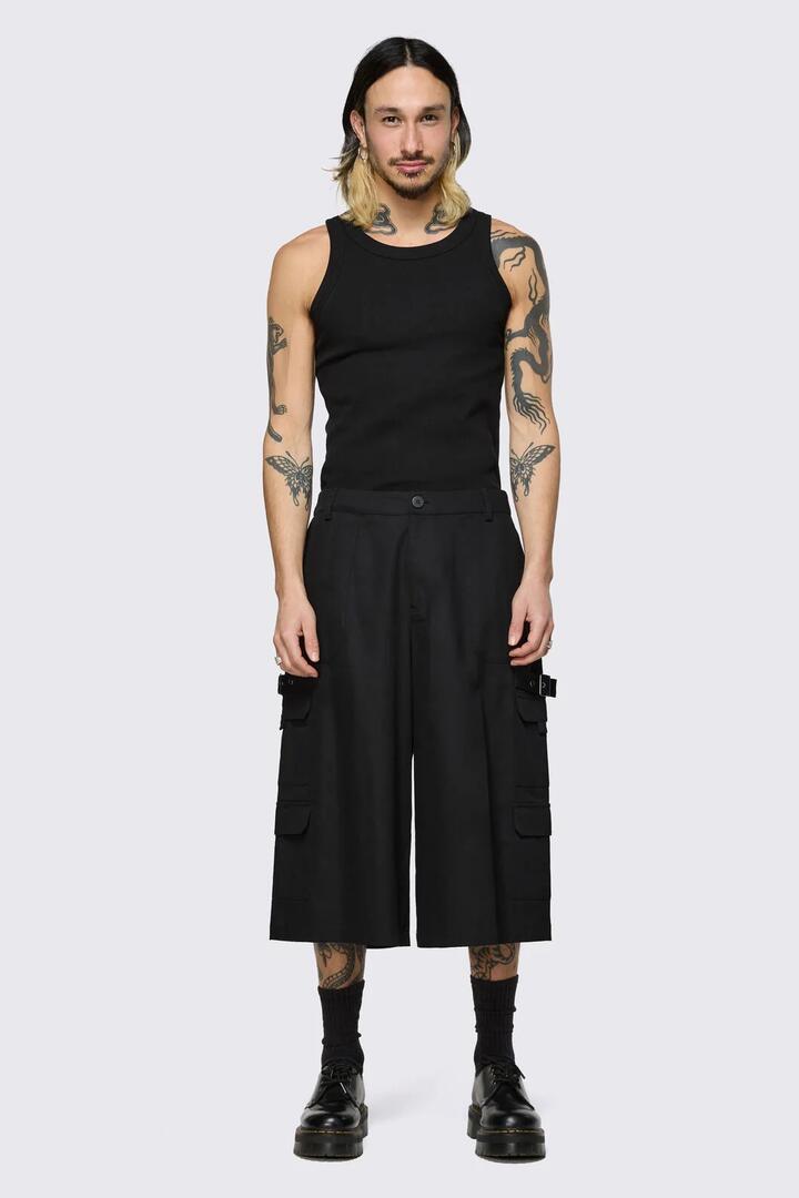 Image of a model wearing Shorts. Product name - Hot Issue Jorts in Black colour by brand - Black Friday