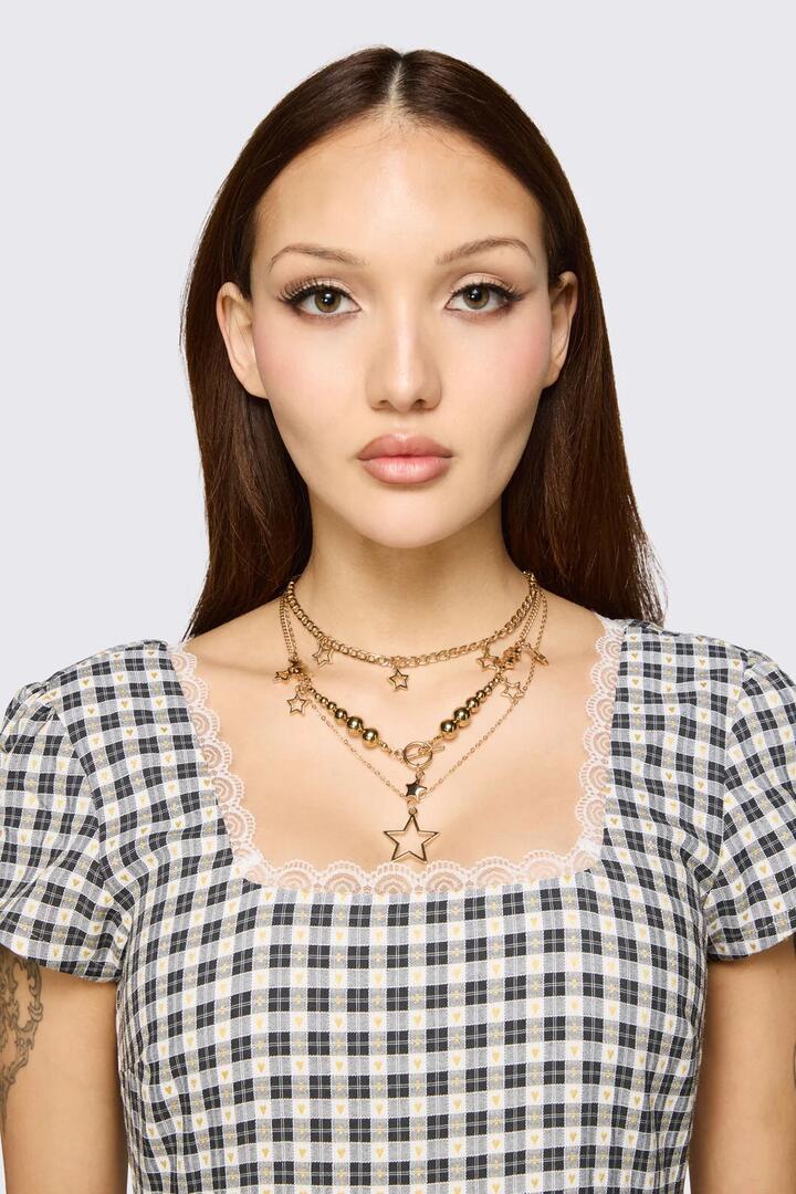Image of Necklaces. Product name - Gold Stars Layer Necklace in Gold colour by brand - Dangerfield