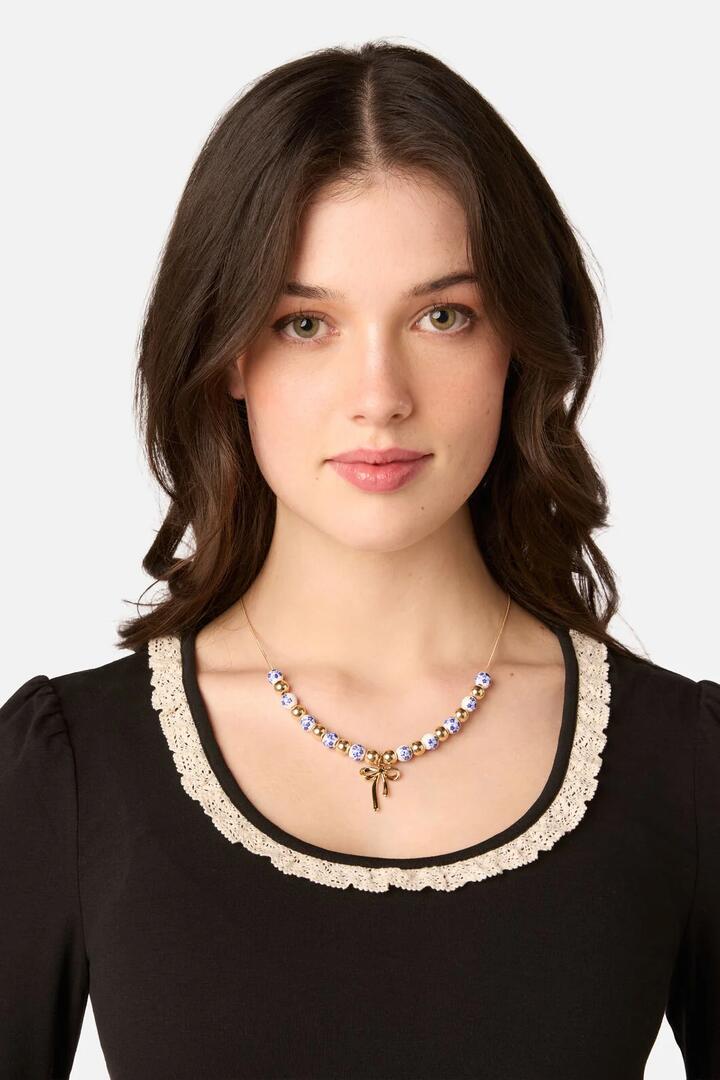 Image of Necklaces. Product name - Blue Flower Bow Necklace in Blue colour by brand - Princess Highway