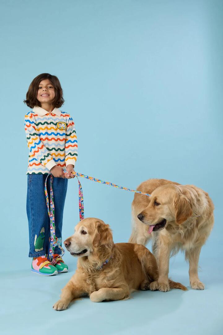 Image of a model wearing Tops. Product name - Squiggle Kids Polo Top in Multi colour by brand - Gorman