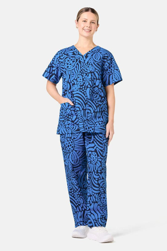 Image of a model wearing Uniforms & Workwear. Product name - Breezy Waters Scrub Set in Navy colour by brand - Gorman