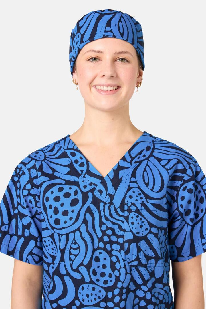 Image of a model wearing Uniforms & Workwear. Product name - Breezy Waters Scrub Hat in Navy colour by brand - Gorman