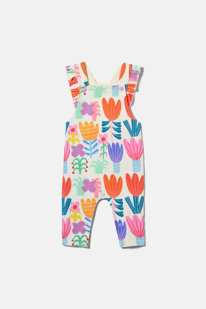 Image of a model wearing Pants. Product name - Tulips Baby Overalls in Multi colour by brand - Gorman