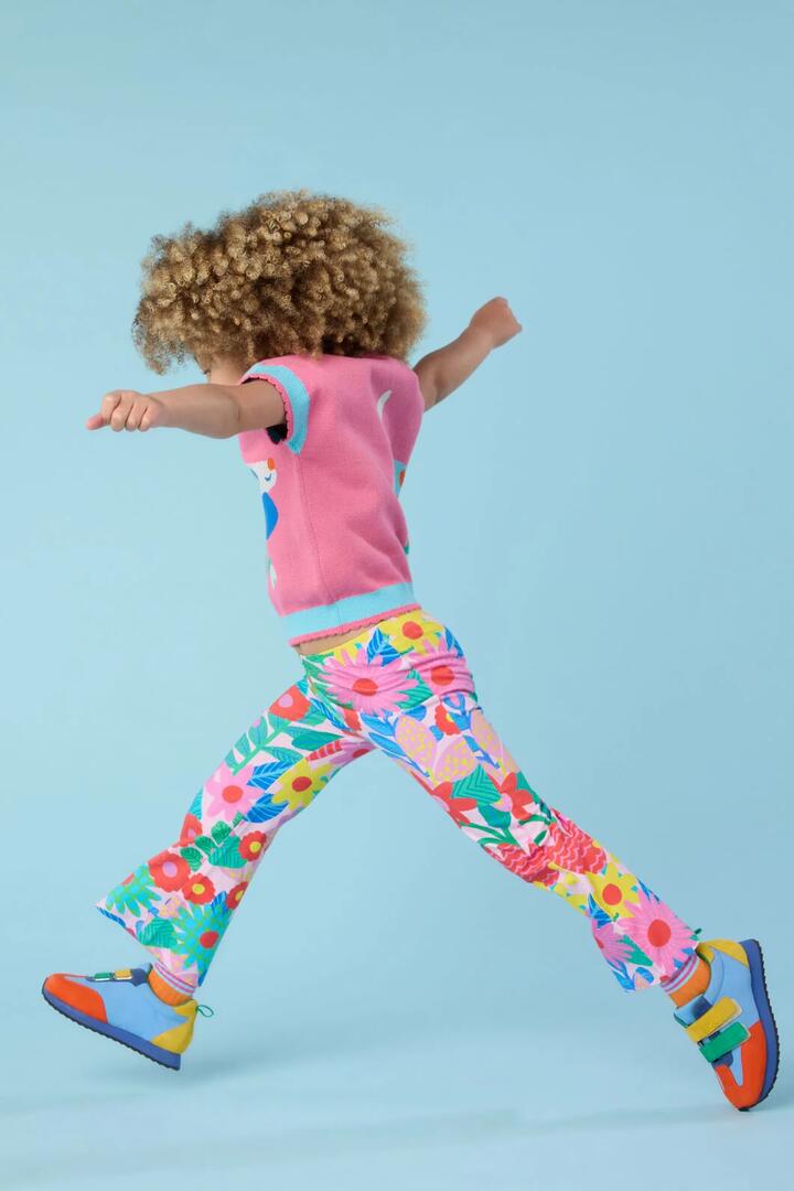 Image of a model wearing Pants. Product name - Floral Pop Kids Legging in Pink colour by brand - Gorman