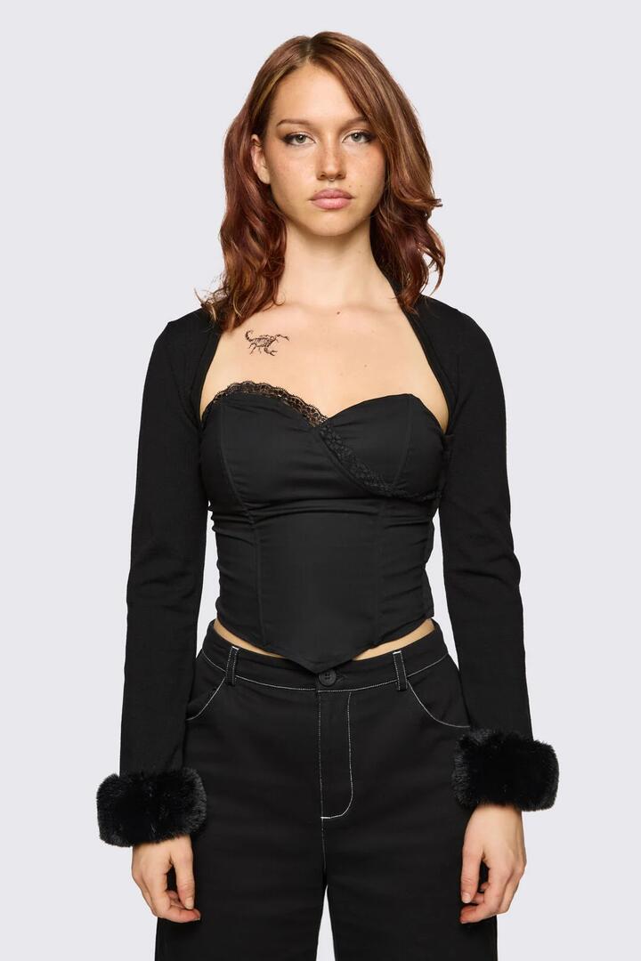 Image of a model wearing Tops. Product name - Cindy Trim Sleeves in Black colour by brand - Dangerfield