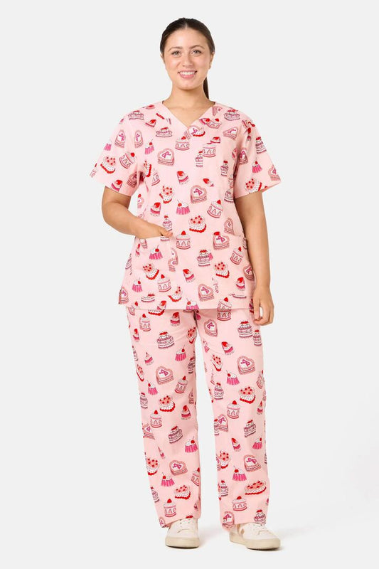 Image of a model wearing Uniforms & Workwear. Product name - Cake Party Scrub Set in Pink colour by brand - Scrubs With Love