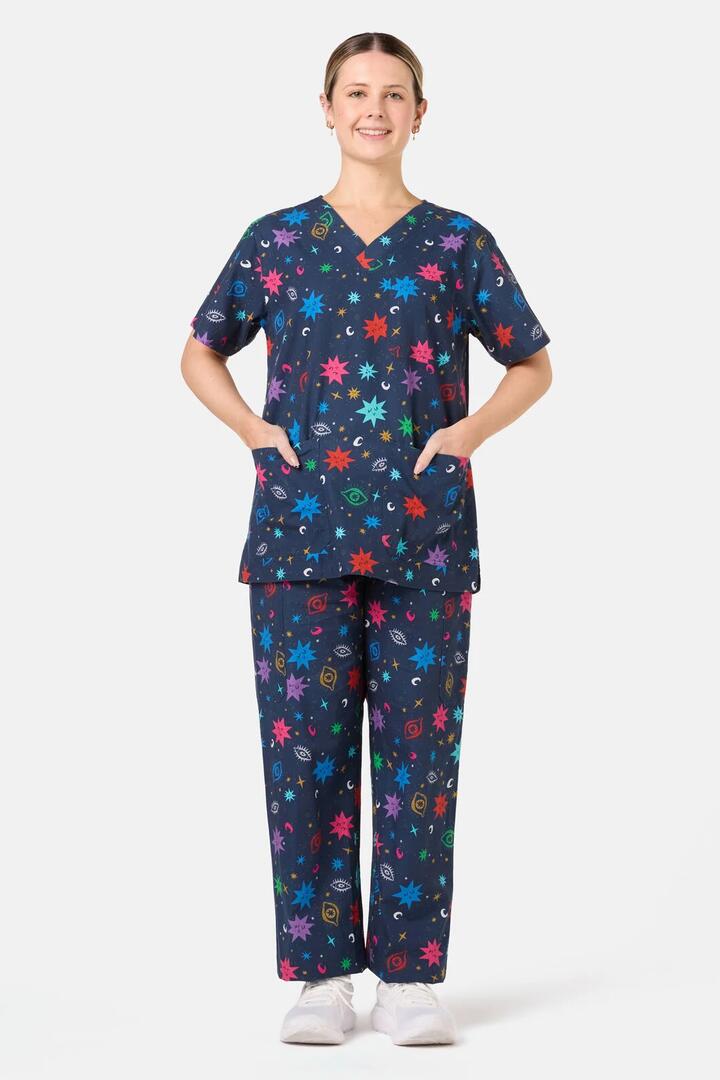 Image of a model wearing Uniforms & Workwear. Product name - Intergalactic Scrub Set in Midnight colour by brand - Scrubs With Love