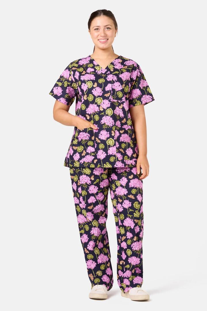 Image of a model wearing Uniforms & Workwear. Product name - Geranium Scrub Set in Navy colour by brand - Scrubs With Love