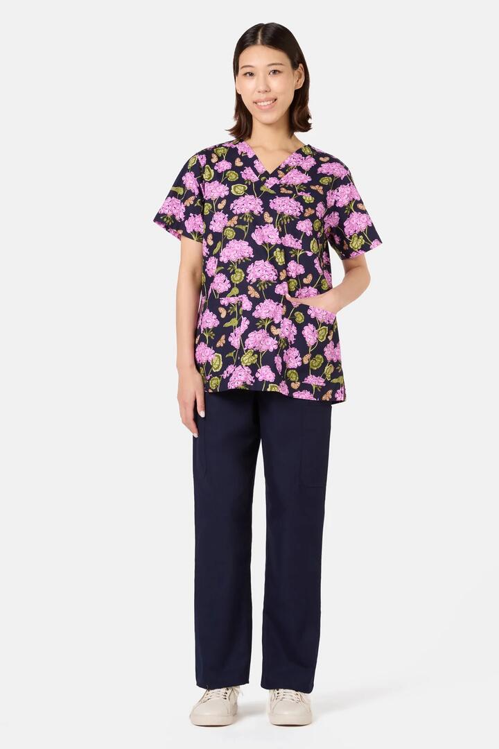 Image of a model wearing Uniforms & Workwear. Product name - Geranium Mixed Scrub Set in Navy colour by brand - Scrubs With Love