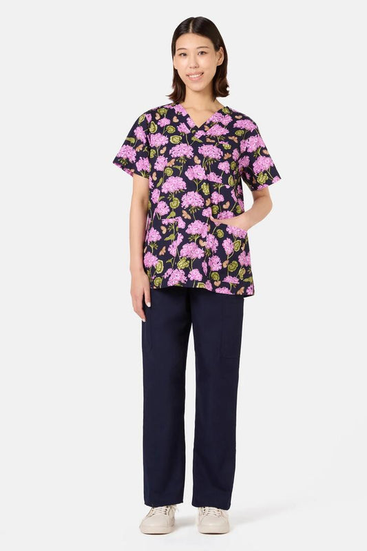Image of a model wearing Uniforms & Workwear. Product name - Geranium Mixed Scrub Set in Navy colour by brand - Scrubs With Love