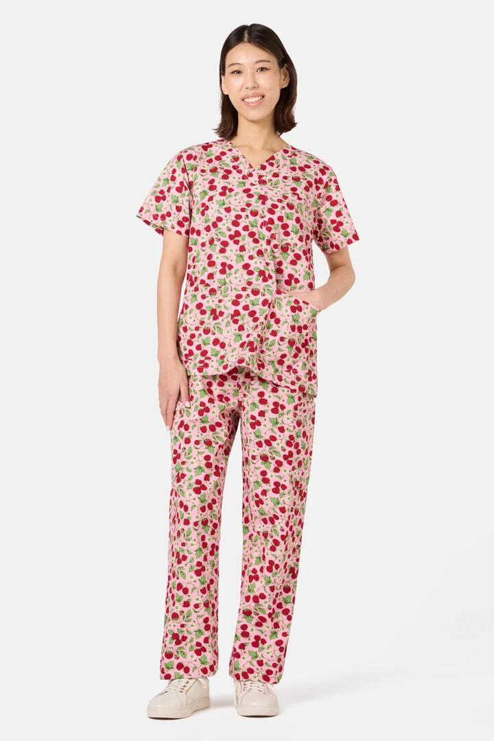 Image of a model wearing Uniforms & Workwear. Product name - Pink Raspberry Scrub Set in Pink colour by brand - Scrubs With Love