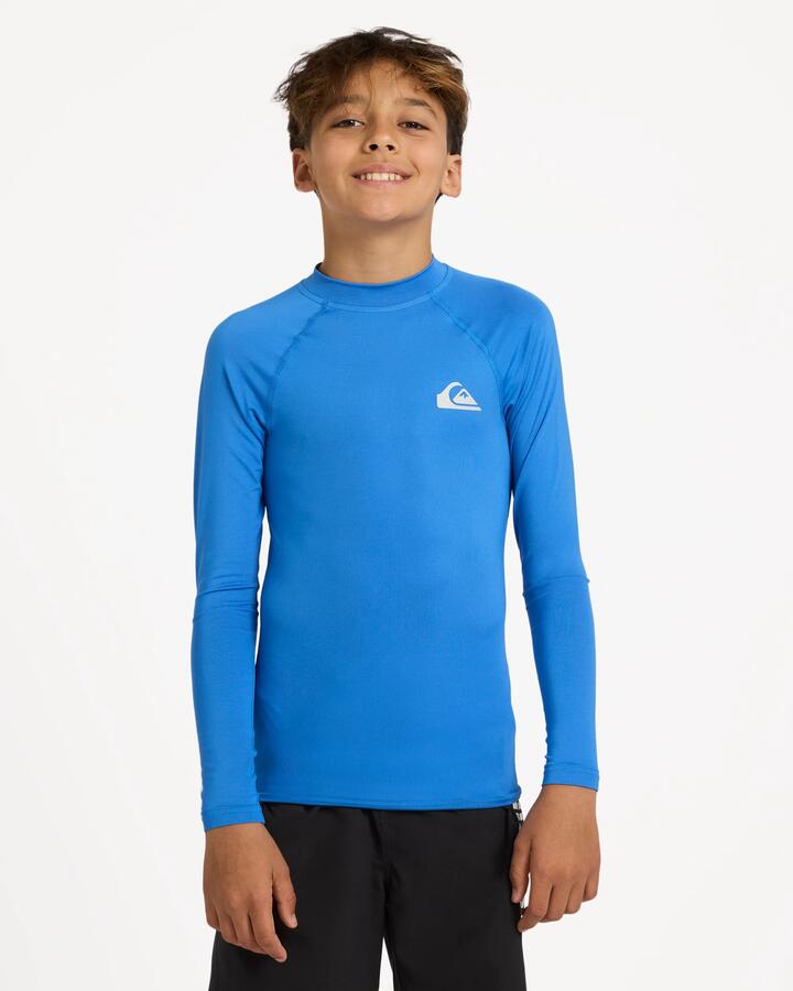 Image of a model wearing Tops. Product name - Quiksilver Boys 8-16 Everyday Upf50 Short Sleeve Rashguard Palace Blue in Palace Blue colour by brand - Quiksilver
