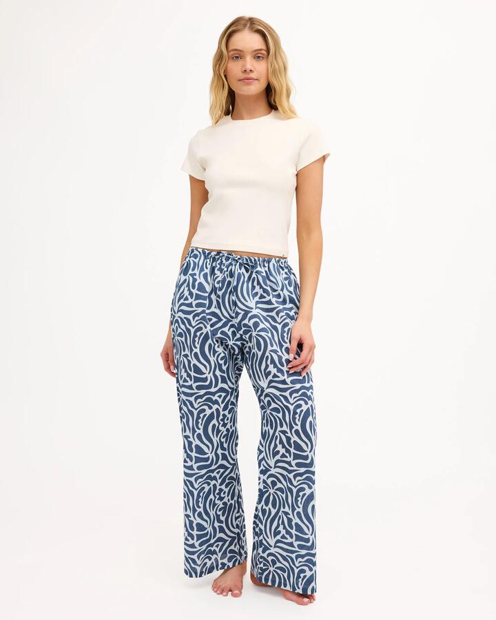Image of a model wearing Pants. Product name - Billabong Womens Oasis Elastic Waist Pants Dusk Blue in Dusk Blue colour by brand - Billabong