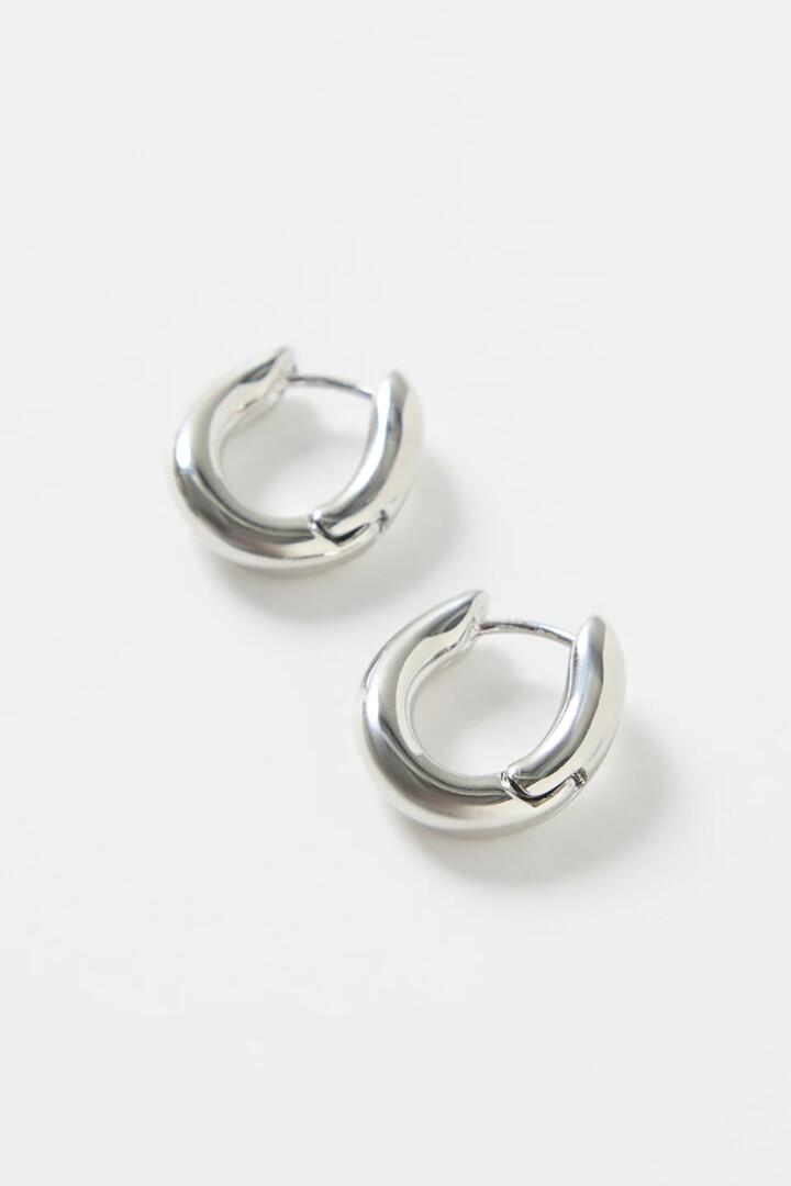 Image of Jewelry. Product name - Oval Wavy Rhodium Hoop Earring in colour by brand - Humble + Heart