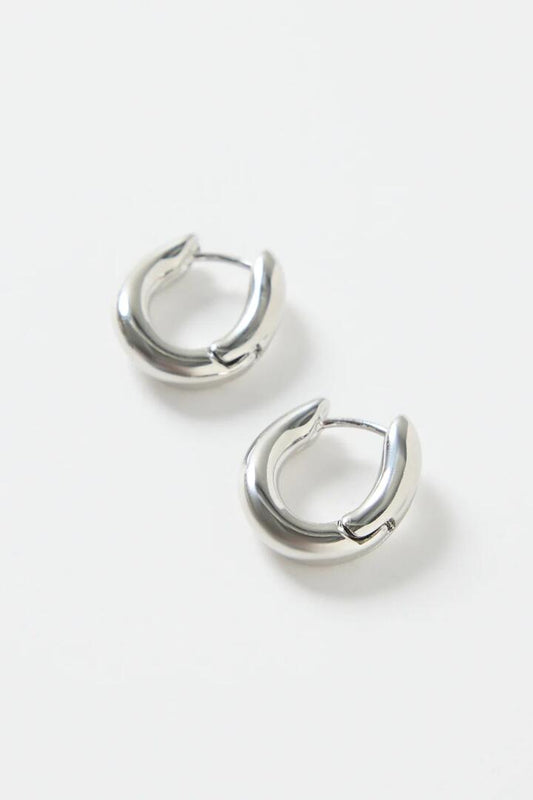 Image of Jewelry. Product name - Oval Wavy Rhodium Hoop Earring in colour by brand - Humble + Heart