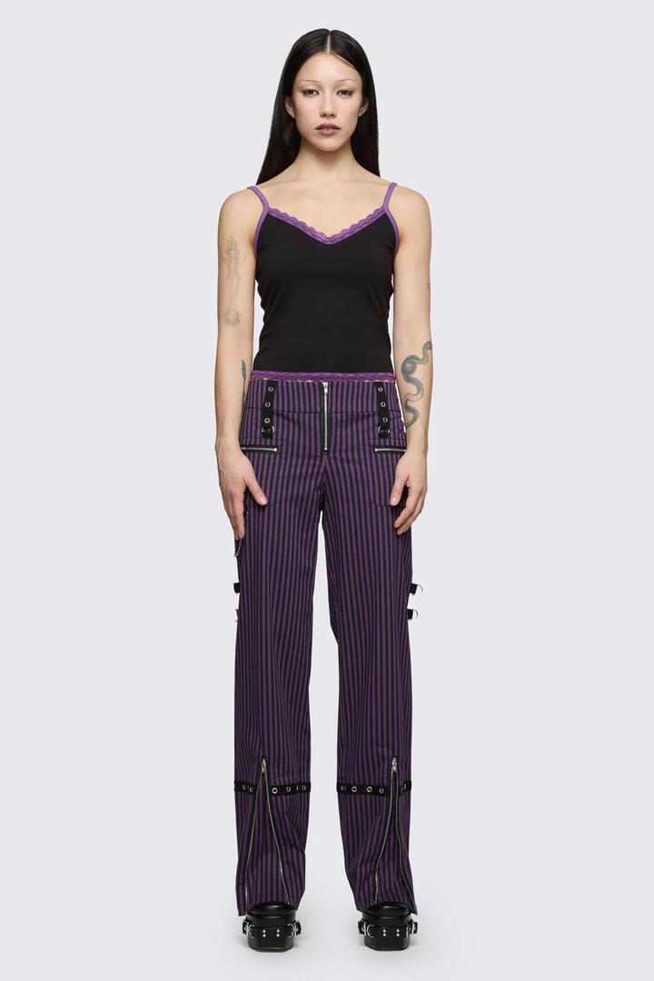 Image of a model wearing Pants. Product name - Spectre Pinstripe Pant in Purple colour by brand - Dangerfield