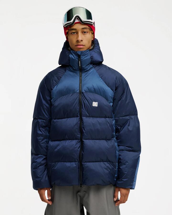 Image of a model wearing Outerwear. Product name - DC Shoes Mens Powder Puffer 10K Snow Jacket Black Iris in Black Iris colour by brand - DC Shoes
