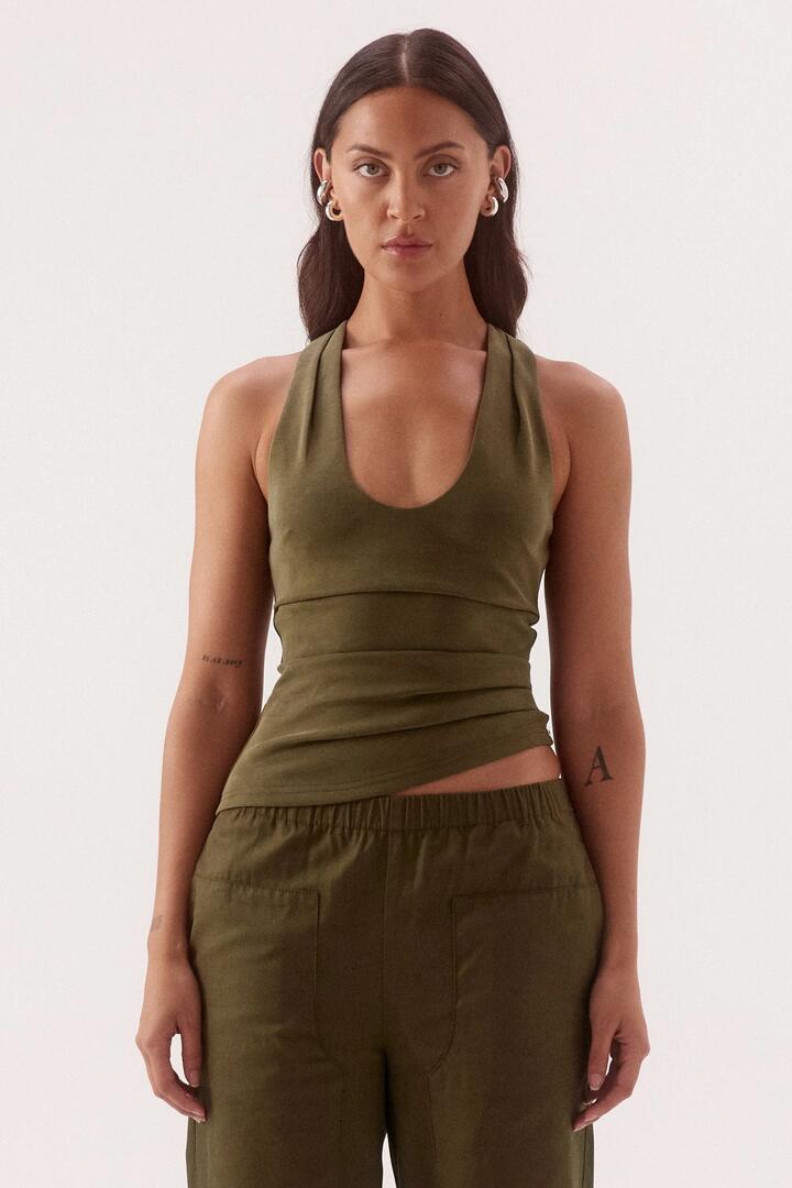 Image of a model wearing Tops. Product name - Lora Deep Khaki Soft Tank in Green colour by brand - Sovere
