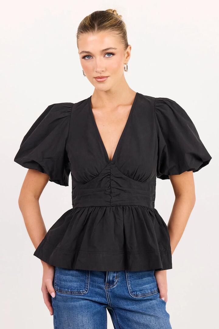 Image of a model wearing Tops. Product name - Beloved Black Poplin Stretch Back Top in Black colour by brand - Among the Brave