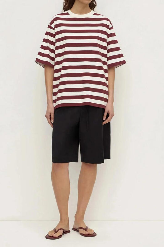 Image of a model wearing Tops. Product name - Arla Raisin Cream Stripe Cotton Stripe Short Sleeve Tee in Red colour by brand - Assembly Label