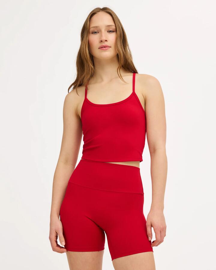 Image of a model wearing Tops. Product name - Surf Dive 'n Ski Womens Rvca Longline Tank Top Scarlet in Scarlet colour by brand - Surf Dive 'n Ski