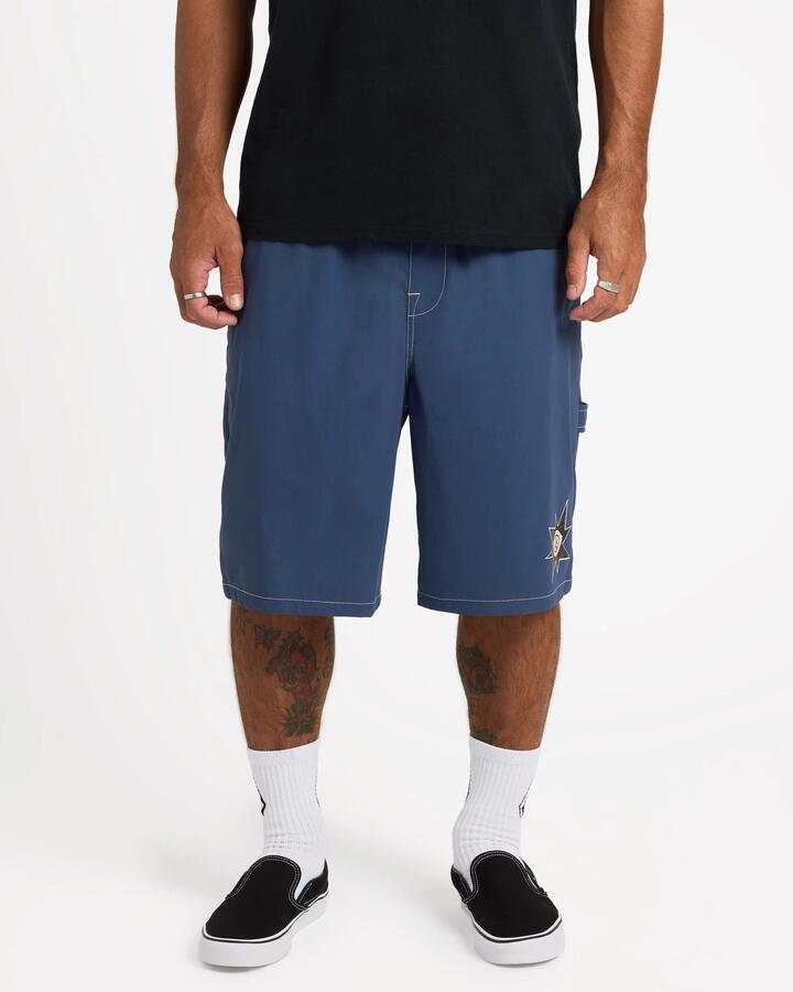 Image of a model wearing Shorts. Product name - Surf Dive 'n Ski Mens Disturb Short 21" Shorts Light Navy in Light Navy colour by brand - Surf Dive 'n Ski