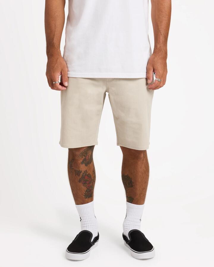 Image of a model wearing Shorts. Product name - Surf Dive 'n Ski Mens Solver Lite 5 Pocket 19" Shorts Stone in Stone colour by brand - Surf Dive 'n Ski