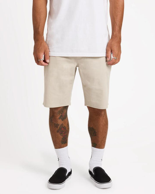 Image of a model wearing Shorts. Product name - Surf Dive 'n Ski Mens Solver Lite 5 Pocket 19" Walkshorts Stone in Stone colour by brand - Surf Dive 'n Ski