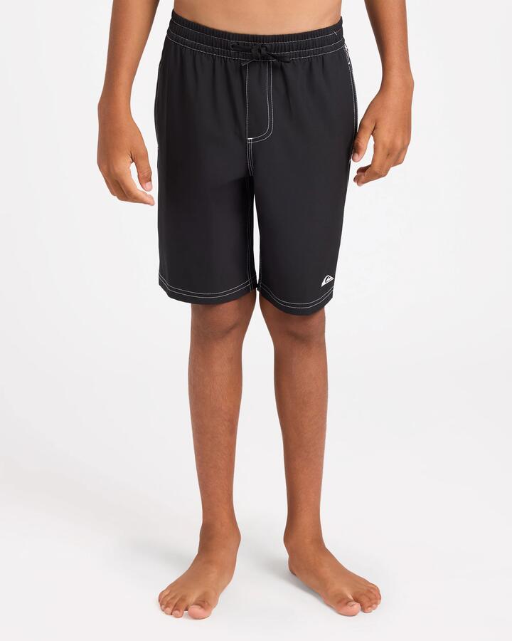 Image of a model wearing Shorts. Product name - Surf Dive 'n Ski Boys 8-16 Pu-Tawhiro Volley 17" Volley Shorts Black in Black colour by brand - Surf Dive 'n Ski
