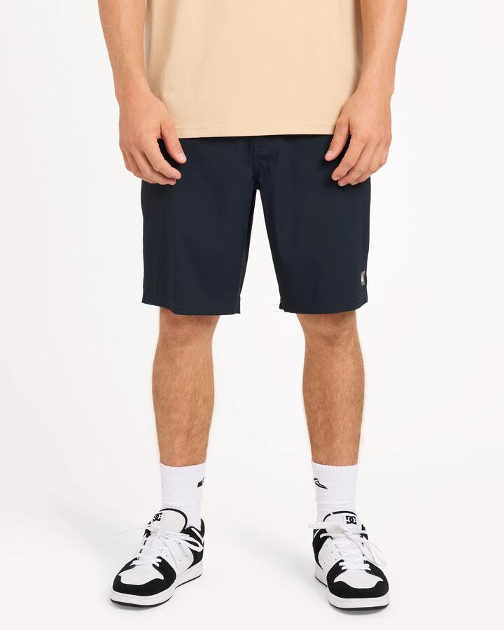 Image of a model wearing Shorts. Product name - Surf Dive 'n Ski Mens Overcast Amphibian 20" Hybrid Shorts Black in Black colour by brand - Surf Dive 'n Ski
