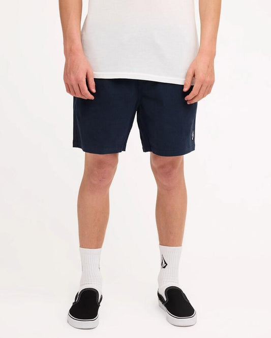 Image of a model wearing Shorts. Product name - Volcom Mens Mfo Lethal Stone Shorts Navy in Navy colour by brand - Volcom