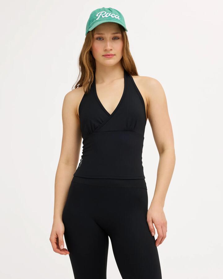 Image of a model wearing Tops. Product name - Surf Dive 'n Ski Womens Va Classic Halter Top Rvca Black in Rvca Black colour by brand - Surf Dive 'n Ski