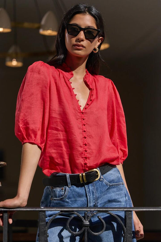 Image of a model wearing Tops. Product name - Continuance Red Ramie High Neck Buttoned SS Top in Red colour by brand - Ivy + Jack