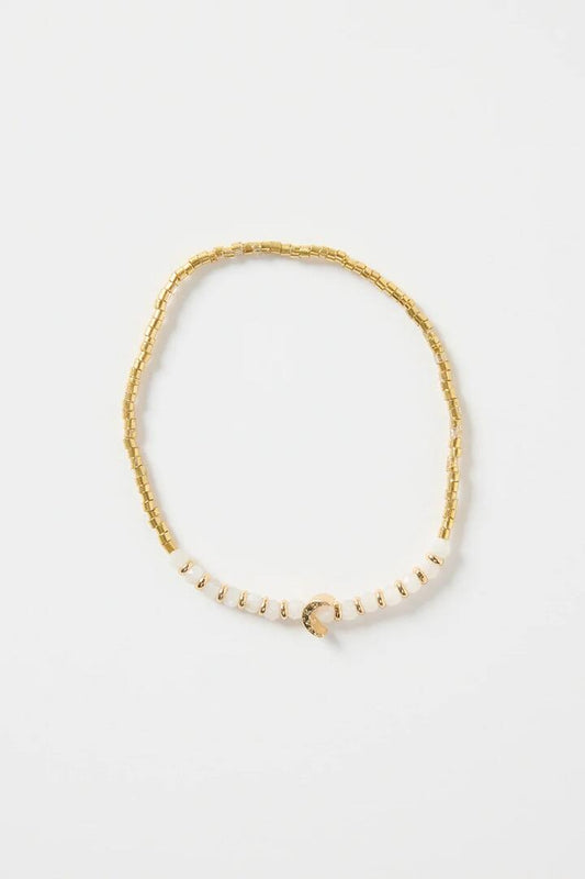 Image of Jewelry. Product name - Ivory Gold Beaded Moon Charm Bracelet in Gold colour by brand - Humble + Heart