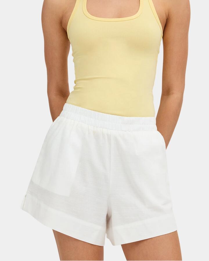 Image of a model wearing Shorts. Product name - Nunui Womens Glaze Elastic Waist Shorts White in White colour by brand - Nunui