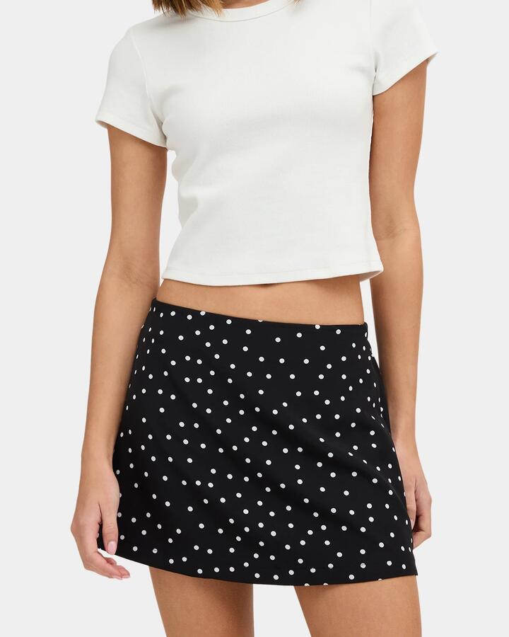 Image of a model wearing Skirts. Product name - Nunui Womens Hail Skort Black in Black colour by brand - Nunui