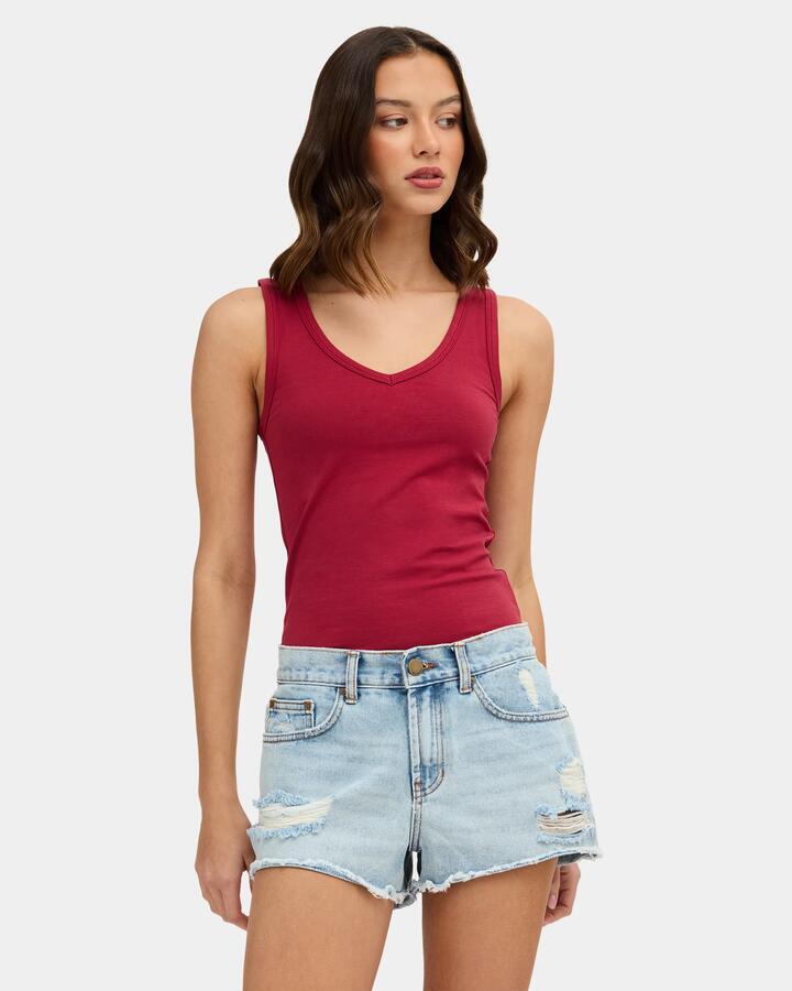 Image of a model wearing Tops. Product name - Nunui Womens Radiant Tank Top Red in Red colour by brand - Nunui