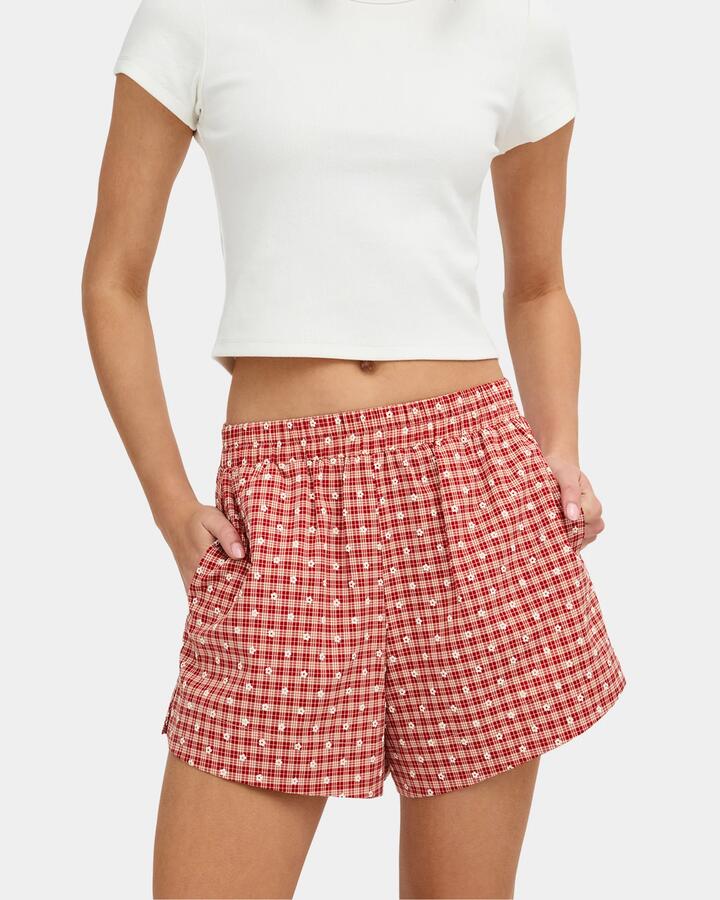 Image of a model wearing Shorts. Product name - Nunui Womens San Fran Elastic Waist Shorts Red in Red colour by brand - Nunui