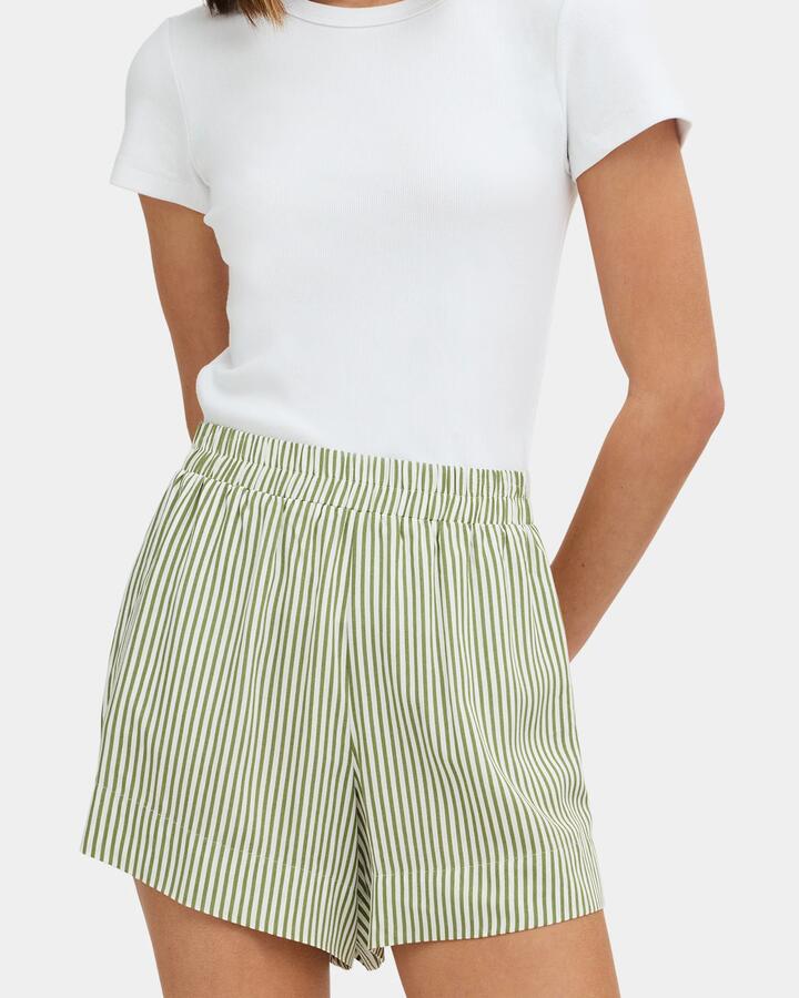 Image of a model wearing Shorts. Product name - Nunui Womens Willa Elastic Waist Shorts Sage in Sage colour by brand - Nunui