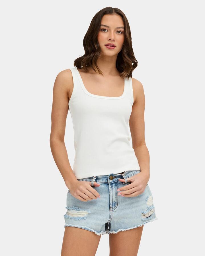 Image of a model wearing Tops. Product name - Nunui Womens Refine Me Tank Top White in White colour by brand - Nunui