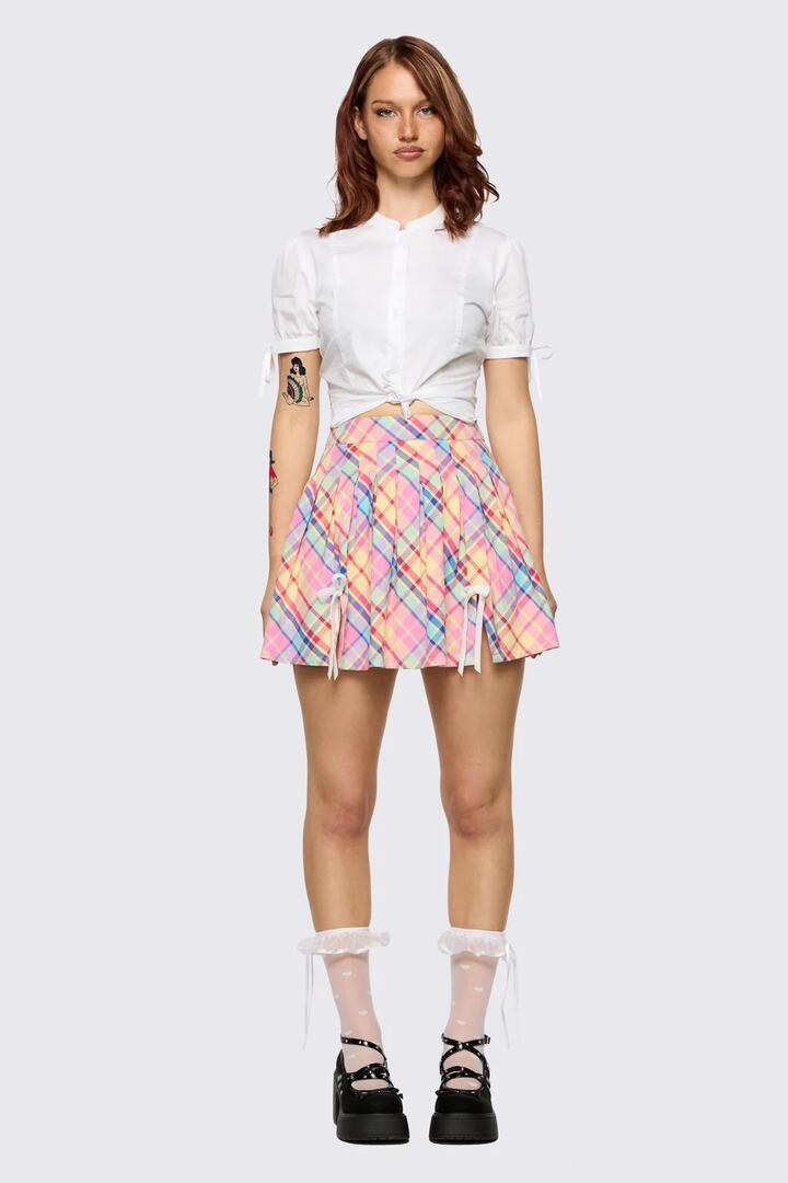 Image of a model wearing Skirts. Product name - Sweetpea Tartan Skirt in Rainbow colour by brand - Dangerfield