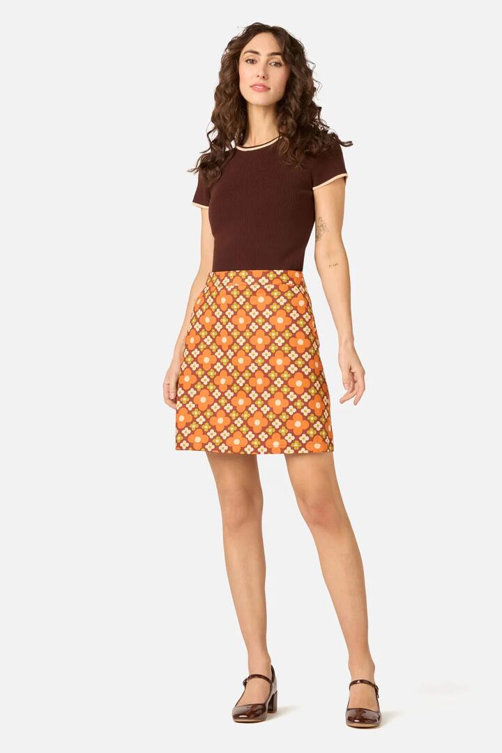 Image of a model wearing Skirts. Product name - Mimi Retro Mini Skirt in Chocolate colour by brand - Princess Highway