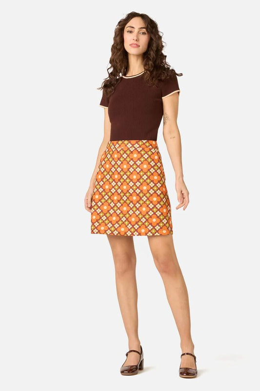 Image of a model wearing Skirts. Product name - Mimi Retro Mini Skirt in Chocolate colour by brand - Princess Highway