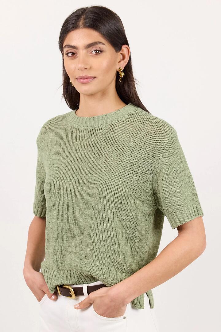 Image of a model wearing Outerwear. Product name - Loveable Sage Tape Yarn Knit Tee in Sage colour by brand - By Rosa.