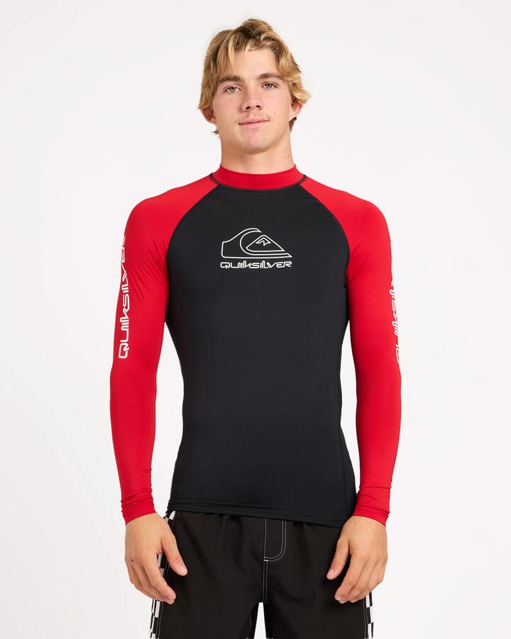 Image of a model wearing Tops. Product name - Surf Dive 'n Ski Mens On Tour Long Sleeve Id Rashguard Black/Salsa in Black/Salsa colour by brand - Surf Dive 'n Ski