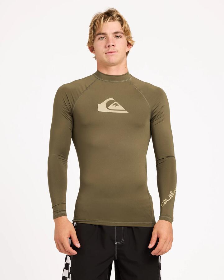 Image of a model wearing Tops. Product name - Surf Dive 'n Ski Mens All Time Upf 50 Long Sleeve Rashguard Grape Leaf in Grape Leaf colour by brand - Surf Dive 'n Ski