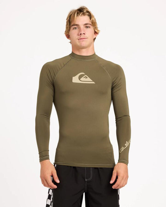 Image of a model wearing Tops. Product name - Surf Dive 'n Ski Mens All Time Upf 50 Long Sleeve Rashguard Grape Leaf in Grape Leaf colour by brand - Surf Dive 'n Ski