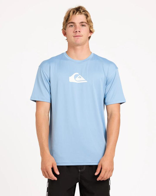 Image of a model wearing Tops. Product name - Surf Dive 'n Ski Mens Solid Streak Upf 50 Short Sleeve Surf Shirt Faded Denim in Faded Denim colour by brand - Surf Dive 'n Ski